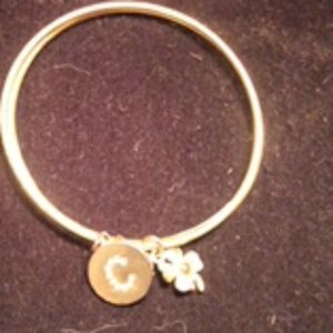 Gold bracelets with charms